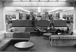 Students study at the Centennial Hall (1971) sunken lounge, St. Cloud State University by St. Cloud State University